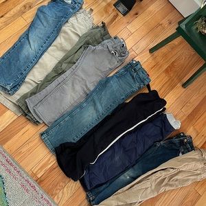 A lot of nine pairs of boys size 6 pants